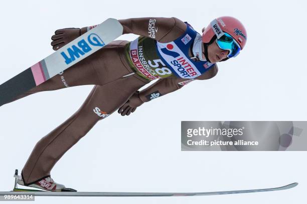 Poland's Dawid Kubacki in action during the qualification run at the Four Hills Tournament in Innsbruck, Austria, 03 January 2018. Photo: Daniel...