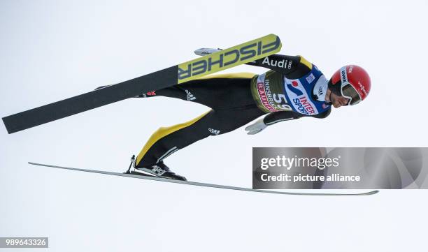 Germany's Markus Eisenbichler in action during the qualification run at the Four Hills Tournament in Innsbruck, Austria, 03 January 2018. Photo:...