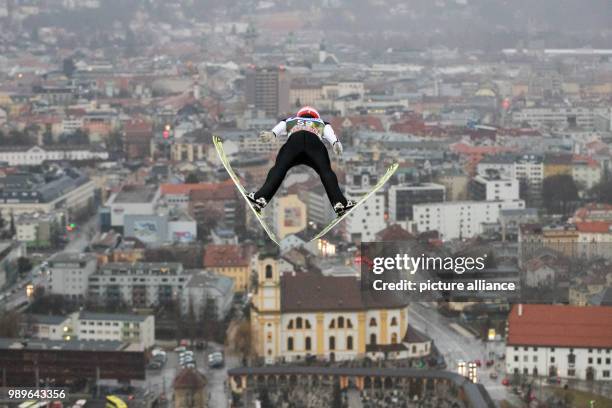 Germany's Markus Eisenbichler in action during the qualification run at the Four Hills Tournament in Innsbruck, Austria, 03 January 2018. Photo:...