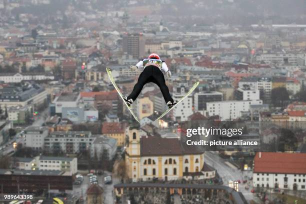 Germany's Markus Eisenbichlerin action during the qualification run of the Four Hills Tournament in Innsbruck, Austria, 03 January 2018. Photo:...