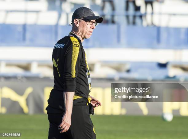 Dortmund's coach Peter Stoeger watches his team during a training session at the training camp of the German Bundesliga football club, Borussia...