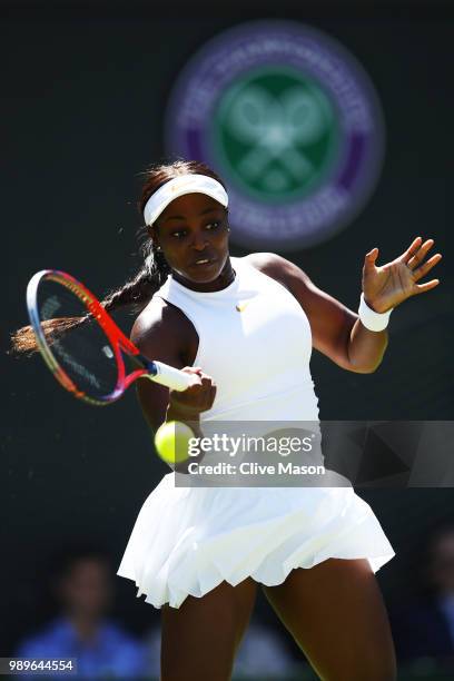 Sloane Stephens of the United States returns to Donna Vekic of Croatia during their Ladies' Singles first round match on day one of the Wimbledon...