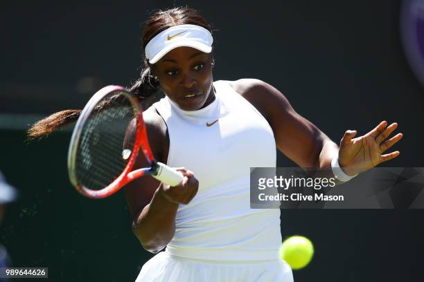 Sloane Stephens of the United States returns to Donna Vekic of Croatia during their Ladies' Singles first round match on day one of the Wimbledon...