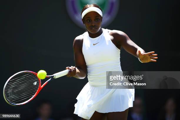 Sloane Stephens of the United States returns to Donna Vekic of Croatia during their Ladies' Singles first round match on day one of the Wimbledon...