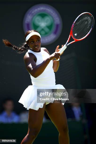 Sloane Stephens of the United States returns to Donna Vekic of Croatia during their Ladies' Singles first round match on day one of the Wimbledon...