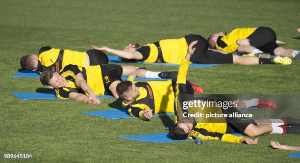 Dortmund players warm up during a training session at the training camp of the German Bundesliga football club, Borussia Dortmund in Marbella, Spain,...