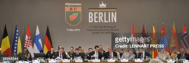 German Defence Minister Karl-Theodor zu Guttenberg and participants of an informal meeting on northern Afghanistan have taken seat on May 11, 2010...