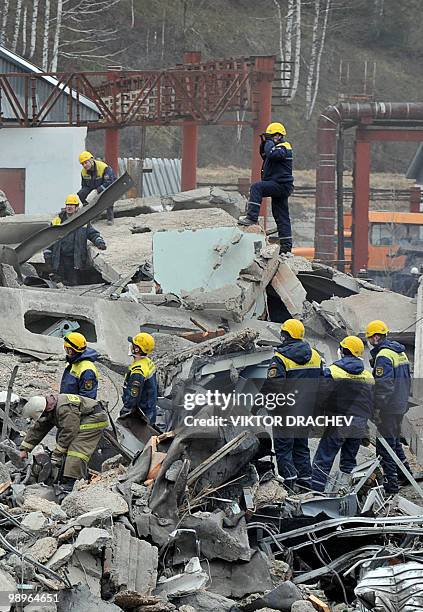 Emergency workers remove debris at the site of an underground explosion, at the Raspadskaya mine in the city of Mezhdurechensk in the west Siberian...