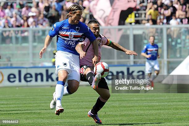 Reto Ziegler of Sampdoria and Fabrizio Miccoli of Palermo compete for the ball during the Serie A match between US Citta di Palermo and UC Sampdoria...