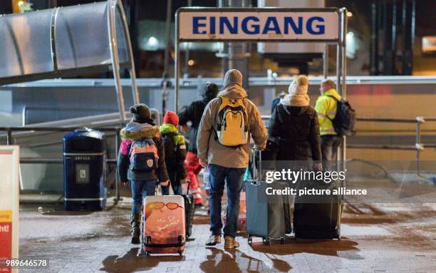 Passengers enter a ferry terminal to board the North Sea ferry FRISIA 3 in Norddeich, Germany, 4 January 2018. It was the first journey of the day,...