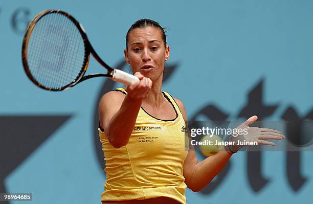 Flavia Pennetta of Italy plays the ball to Andrea Petkovic of Germany in their second round match during the Mutua Madrilena Madrid Open tennis...