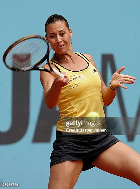 Flavia Pennetta of Italy plays the ball to Andrea Petkovic of Germany in their second round match during the Mutua Madrilena Madrid Open tennis...