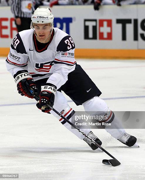 Mike Lundin of USA runs with the puck during the IIHF World Championship group A match between USA and Denmark at Lanxess Arena on May 10, 2010 in...