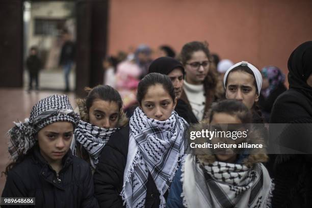 Relatives of 17-year-old Palestinian Musab Tamimi attend his funeral, after he was shot dead a day earlier in clashes with Israeli soldiers, in the...