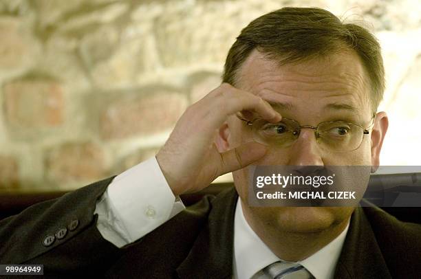 Leader and Chairman of the Czech Civic Democratic Party , Petr Necas adjusts his glasses during an interview on May 11, 2010 in Prague. The Czech...