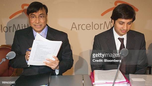 Lakshmi Mittal, chief executive officer of ArcelorMittal, left, and Aditya Mittal, chief financial officer of ArcelorMittal, pause during the...