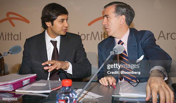 Aditya Mittal, chief financial officer of ArcelorMittal, left, speaks with Gonzalo Urquijo, a member of the management board of ArcelorMittal, during...