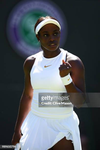 Sloane Stephens of the United States celebrates a point against Donna Vekic of Croatia during their Ladies' Singles first round match on day one of...