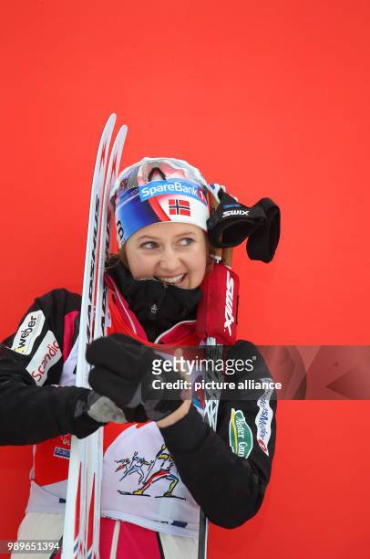 Ingvild Flugstad Oestberg from Norway celebrates her victory in the women's 10km freestyle race at FIS Tour de Ski in Oberstdorf, Germany, 4 January...