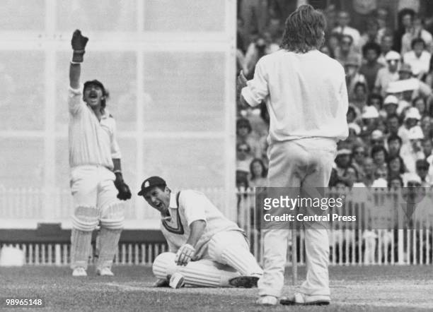 Cricketer Fred Titmus on the ground after being hit on the inside of his knee by Australian fast-bowler Jeff Thomson during the Third Test at...