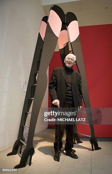 French illustrator and children's books author Tomi Ungerer poses in front of one of his works on May 11, 2010 during a preview of his exhibition...