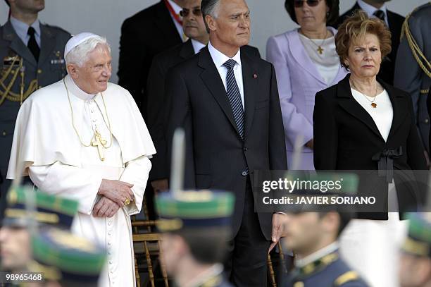 Pope Benedict XVI , Portugal's President Anibal Cavaco Silva and his wife Maria, review troops during a visit to Jeronimo's Monastery in Lisbon on...