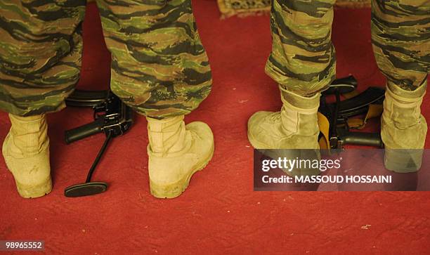 Afghan security personnel pray in the morning of Eid-Al-Adha at the Eid Gah mosque in Kabul on November 27, 2009. The festival of sacrifice is...