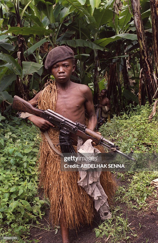 A Zairian Mai-Mai militia rebel child so