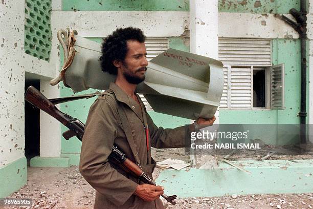 Yemenite fighter, partisan of Yemen Socialist Party senior leader Abdul Fattah Ismail, holds a bomb, in February 1986, in Aden. On January 13 a brief...