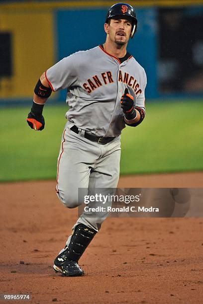 Aaron Rowand of the San Francisco Giants runs to third base during a MLB game against the Florida Marlins in Sun Life Stadium on May 6, 2010 in...