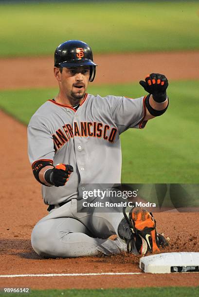 Aaron Rowand of the San Francisco Giants slides into third base during a MLB game against the Florida Marlins in Sun Life Stadium on May 6, 2010 in...