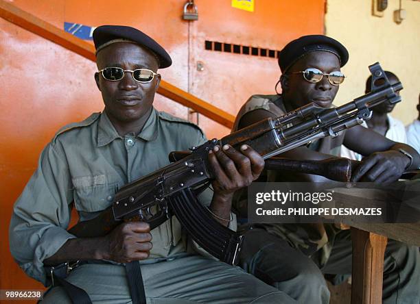 Rebel soldier poses with his weapon in the rebel strong-hold of Korhogo 02 October 2002. Ivory Coast plunged into conflict September 19, when an...