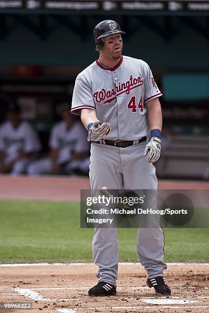 Adam Dunn of the Washington Nationals drops his bat during a MLB game against the Florida Marlins in Sun Life Stadium on May 2, 2010 in Miami,...