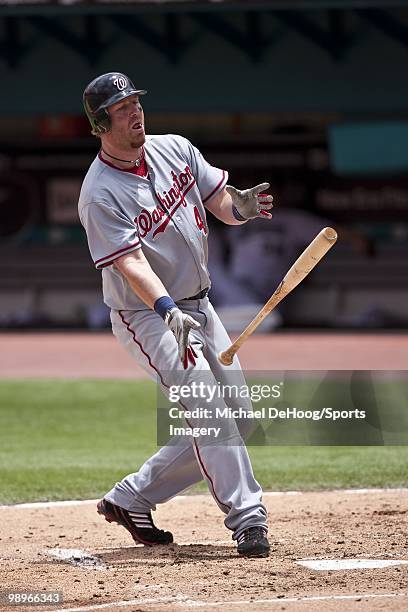 Adam Dunn of the Washington Nationals drops his bat during a MLB game against the Florida Marlins in Sun Life Stadium on May 2, 2010 in Miami,...