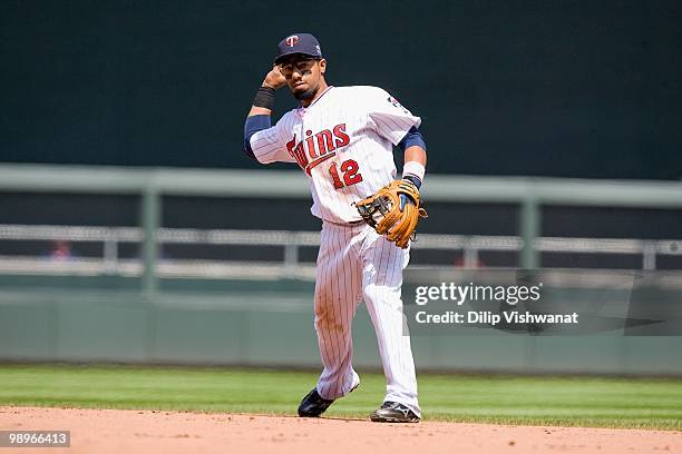 Alexi Cassila of the Minnesota Twins throws to first base against the Baltimore Orioles at Target Field on May 9, 2010 in Minneapolis, Minnesota. The...