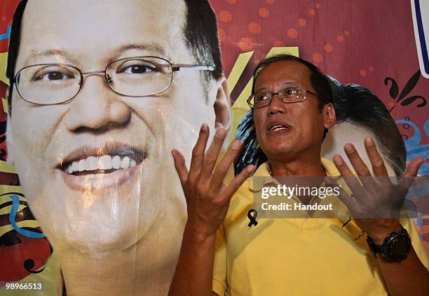 This handout photo shows Philippine Senator Benigno Aquino III as he gestures during a press briefing in Hacienda Luisita, on May 11, 2010 in Tarlac...