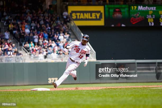 Alexi Casilla of the Minnesota Twins rounds third base against the Baltimore Orioles at Target Field on May 9, 2010 in Minneapolis, Minnesota. The...