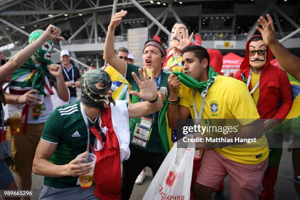 Brazil and Mexico fans enjoy the pre match atmosphere during the 2018 FIFA World Cup Russia Round of 16 match between Brazil and Mexico at Samara...