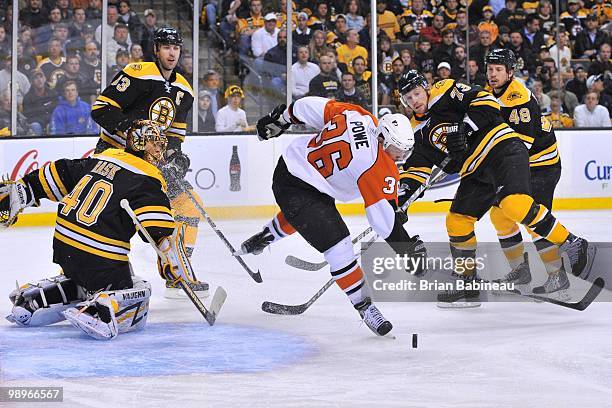 Darroll Powe of the Philadelphia Flyers trips on the ice against the Boston Bruins in Game Five of the Eastern Conference Semifinals during the 2010...