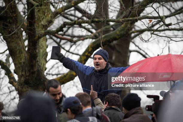 The British, Christian speaker 'Dave' speaks with a bible in his hand on a stepladder at the Speakers' Corner at Hyde Park in London, Britain, 10...