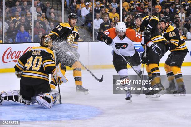 Darroll Powe of the Philadelphia Flyers trips on the ice against the Boston Bruins in Game Five of the Eastern Conference Semifinals during the 2010...