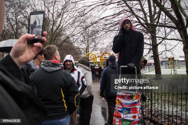 The British speaker 'Zakariya' is being filmed while saying a prayer on a stepladder at the Speakers' Corner at Hyde Park in London, Britain, 10...