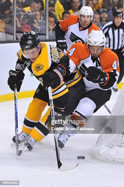Kimmo Timonen of the Philadelphia Flyers skates after the puck against Vladimir Sobotka of the Boston Bruins in Game Five of the Eastern Conference...