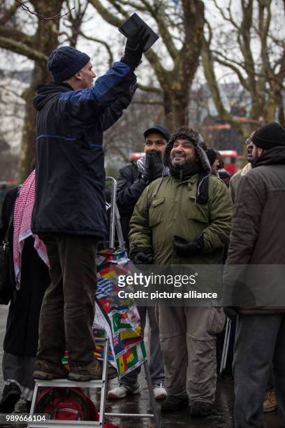 The British, Christian speaker 'Dave' speaks with a bible in his hand on a stepladder at the Speakers' Corner at Hyde Park in London, Britain, 10...