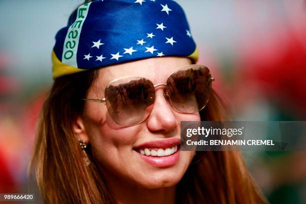 Brazil fan poses before the Russia 2018 World Cup round of 16 football match between Brazil and Mexico at the Samara Arena in Samara on July 2, 2018....