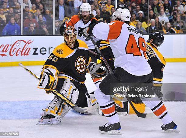 Tuukka Rask of the Boston Bruins makes a save against Danny Briere of the Philadelphia Flyers in Game Five of the Eastern Conference Semifinals...