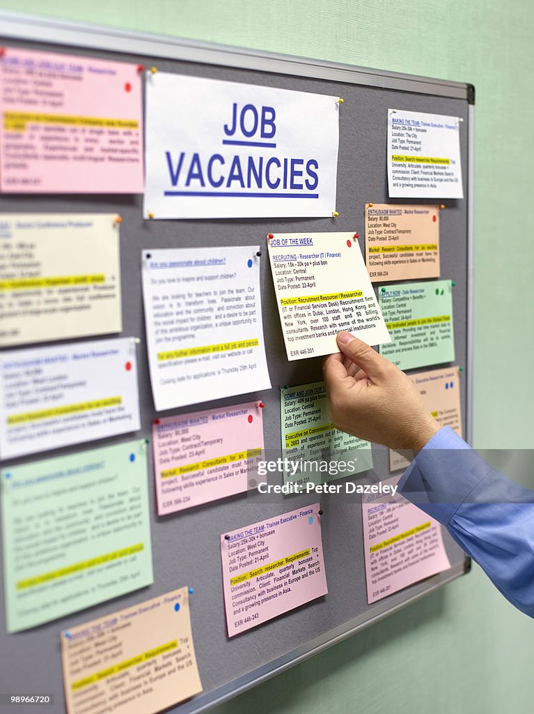 Senior man at job vacancies board