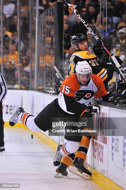 Andreas Nodi of the Philadelphia Flyers checks Zdeno Chara of the Boston Bruins in Game Five of the Eastern Conference Semifinals during the 2010 NHL...