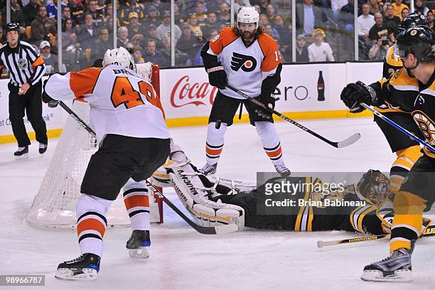 Danny Briere of the Philadelphia Flyers passes the puck to team mate Scott Hartnell who then scored a goal against the Boston Bruins in Game Five of...