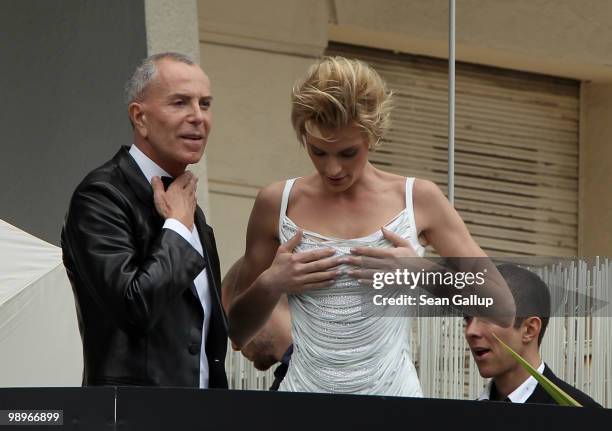 French designer Jean-Claude Jitrois and friend Sarah Marshall attend a photo shoot on a balcony prior to the annual film festival on May 11, 2010 in...
